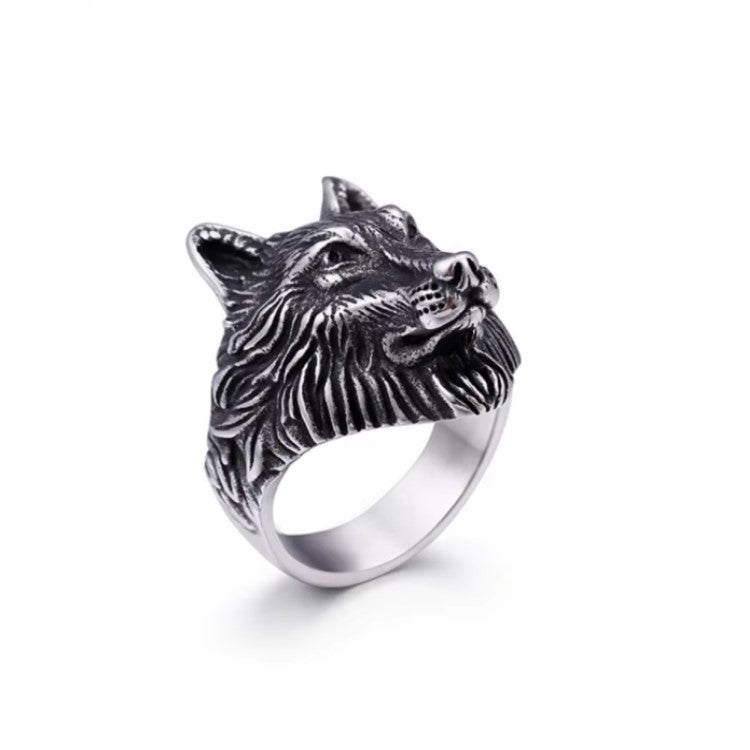 Stainless steel ring with wolf head pattern design.